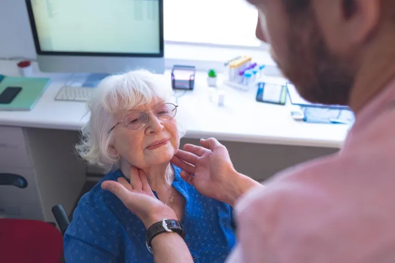 Doctor consulting with a senior patient about swallowing assessment results